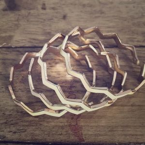 Set of 4 enamel off white chevron bracelets.